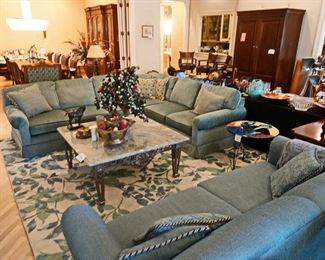 Designer sofas, marble and steel coffee table