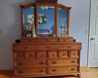 Antique design newer bedroom set (behind the center mirror is a jewelry case)