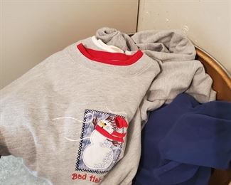Numerous sweatshirts in this bin