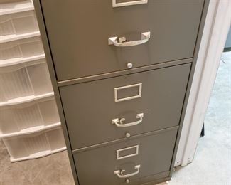Solid 3-drawer metal file cabinet....begins the basement items