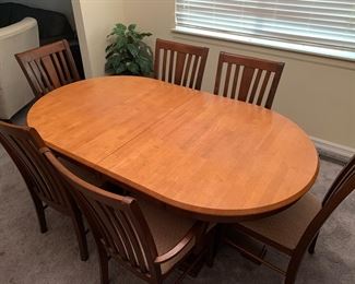 Dinette with 6 chairs 6-8 feet built in leaves matching china cabinet