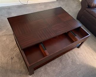 coffee table with slide compartment