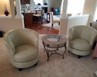 Two Leather Swivel Chairs