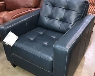 blue leather chair at Orlando Estate Auction