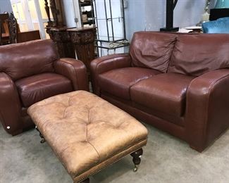 red leather sofa and arm chair at Orlando Estate Auction