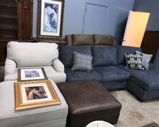 blue sectional and grey chair and ottoman