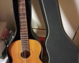 Acoustic guitar.  Lots of guitar books and magazines