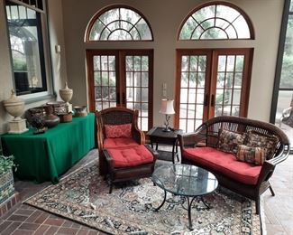 View of the sunroom with patio furniture and accessories