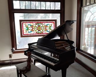 Antique grand piano with bench