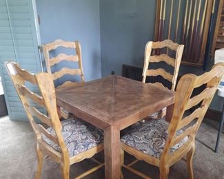 Leather covered game table; set of four ladder back chairs
