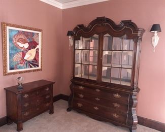 Impressive lighted retro breakfront; original angel oil painting; three drawer chest with brass hardware