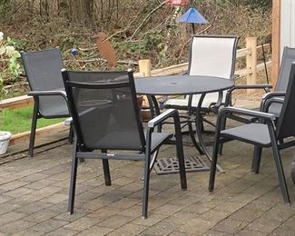 Patio set with 4 chairs and purple umbrella (not pictured)