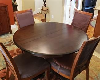 Round dining set with 6 chairs and leaf