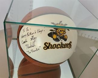 Autographed and personalized basketball by former Shockers Coach Gregg Marshall in heavy duty display case.