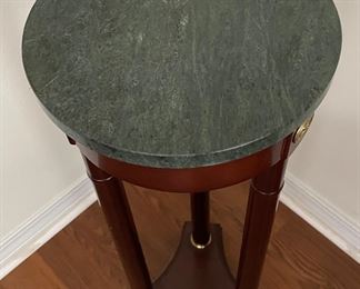 23_____$68 	
Column stand with marble green top round 32x11	