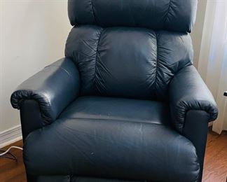 27_____$130 	
One of two naugahide Manual blue recliner 40Tx32W	
