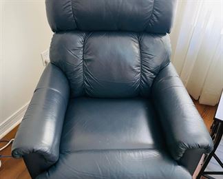 27_____$130 	
One of two naugahide Manual blue recliner 40Tx32W	