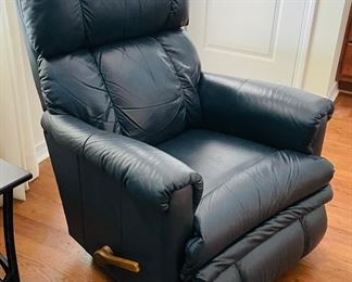 28_____$150 	
One of two naugahide Manual blue recliner 40Tx32W 1 swivel