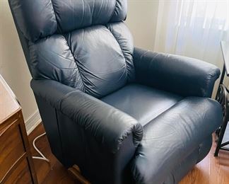 28_____$150 	
One of two naugahide Manual blue recliner 40Tx32W 1 swivel