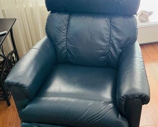 28_____$150 	
One of two naugahide Manual blue recliner 40Tx32W 1 swivel