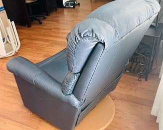 28_____$150 	
One of two naugahide Manual blue recliner 40Tx32W 1 swivel