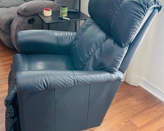 28_____$150 	
One of two naugahide Manual blue recliner 40Tx32W 1 swivel