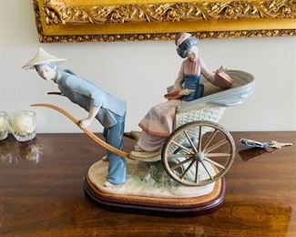 38_____$250 	
Lladro 1383 China lady in rikshaw 15x13x9 - missing finger -AS is 