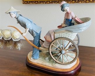 38_____$250 	
Lladro 1383 China lady in rikshaw 15x13x9 - missing finger -AS is 
