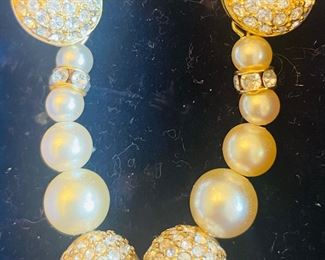 _____$50 	
Swarovski pearl drop earrings 