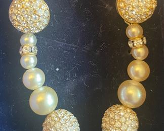 _____$50 	
Swarovski pearl drop earrings 