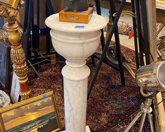 Marble pedestal with bronze sign by the artist.