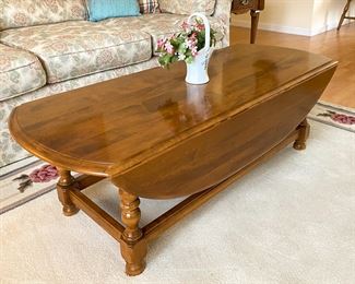Ethan Allen Coffee Table with folding leaves.