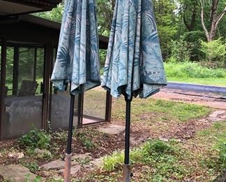 Pair of Wrought Iron Patio Umbrella Stands with Faded Umbrellas $45 Each