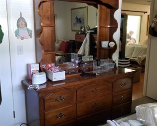 Dresser with attached mirror and shelf unit