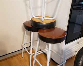 Three metal bar stools