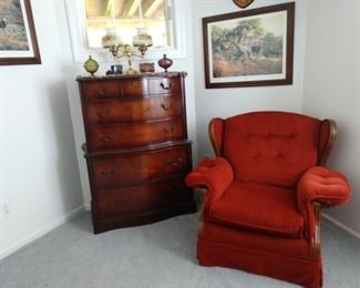 Antique chester drawers, and orange chair.