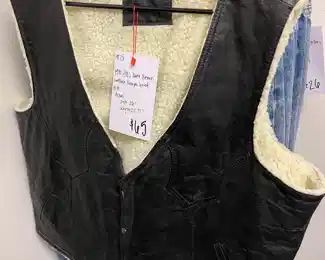 Vintage Leather and Sherpa lined Vest with snap closures with Western stitch detailing.
Circa: 1970s 
Color: Dark Chocolate 