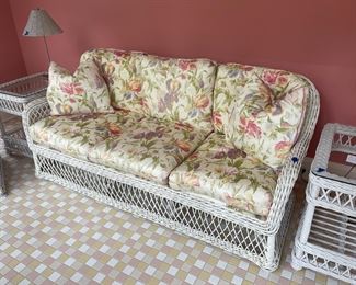 Walter Wicker Sofa and Club Chair. Custom finished and upholstered in a beautiful floral print by Boussac.