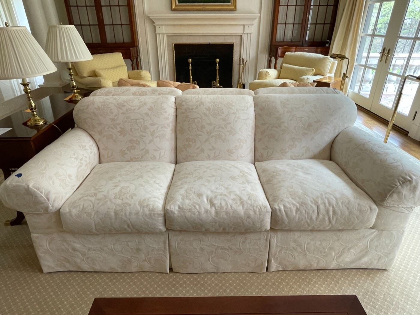 Baker rolled arm sofa, tight back with three loose seat cushions and skirt.  Upholstered in Luciano Marcato fabric.   Two identical sofas available.