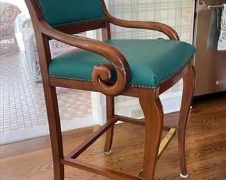 Trouvailles; Restoration "B" Bar Stool.  Finished with antique brass nails, brass footrail and upholstered in a Paul Brayton Spruce, nylon, fabric.  Four chairs available.
