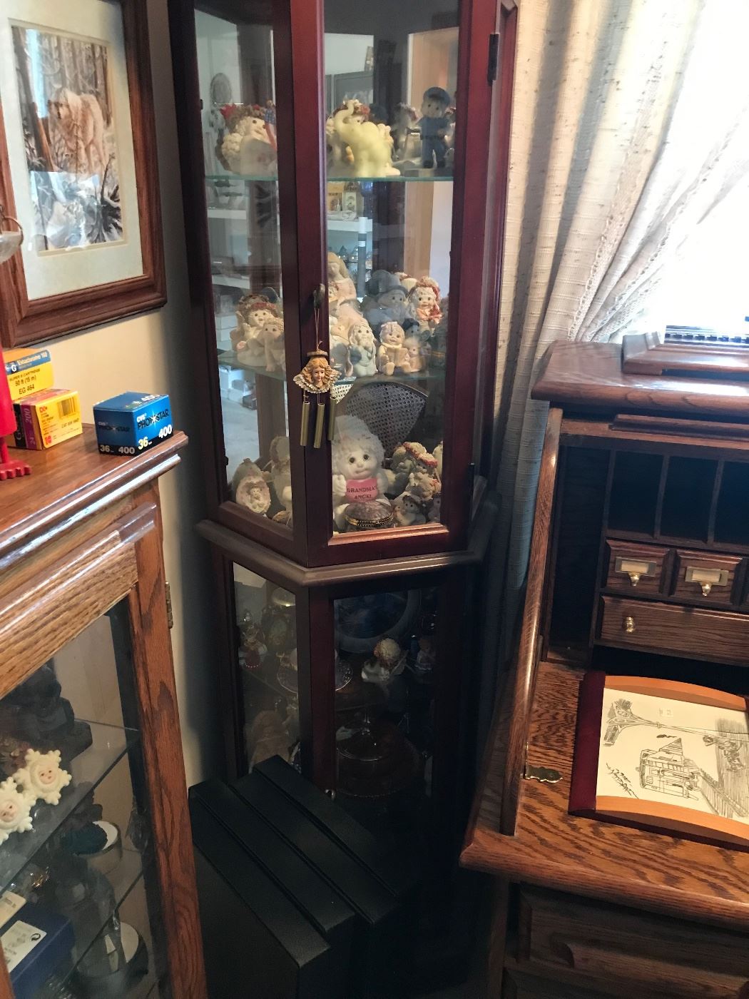 3 curio cabinets full of small collectibles! This one has Snow Babies!