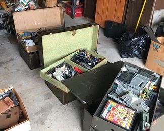 3 trunks in the garage of G.I. Joe items, some new in package!