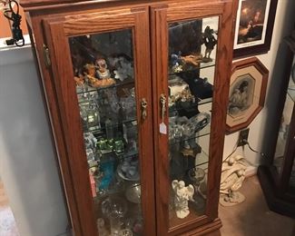 Oak cabinet filled with small collectibles! Etched crystal blocks and stands of every theme!