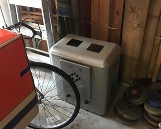 Vintage heater and hiding behind the table is a vintage Columbia Men's bicycle!