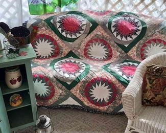 Beautiful Hand Stitched Quilt With White Wicker CouchChair And More