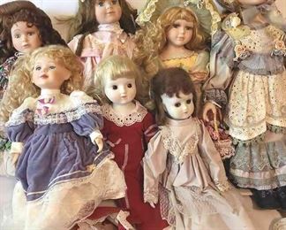 Seven Porcelain And Cloth Dolls