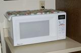 Heat things up with this like new microwave.
