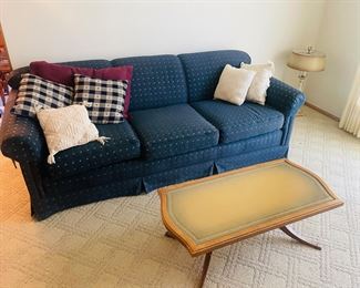Blue Upholstered Couch $40.00     Leather Inlay Coffee Table $40.00