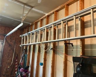 spreader garage items gas cans wheelbarrow generator ladder