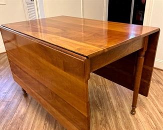 Stickley cherry drop leaf table leaves dropped down